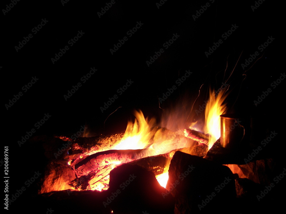 Sparks and flares of a night fire forest Sparks and flares of a night fire forest