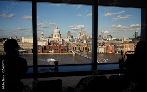 London St. Paul`s Cathedral, view from Tate Modern with Silhouetted unnamed people photo