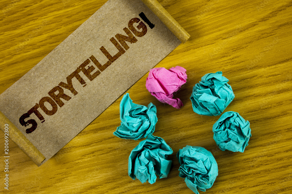 Handwriting text writing Storytelling Motivational Call. Concept meaning Tell short Stories Personal Experiences written on Folded Cardboard Paper piece on wooden background Paper Balls.