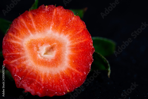 Strawberries in a section on a black background
