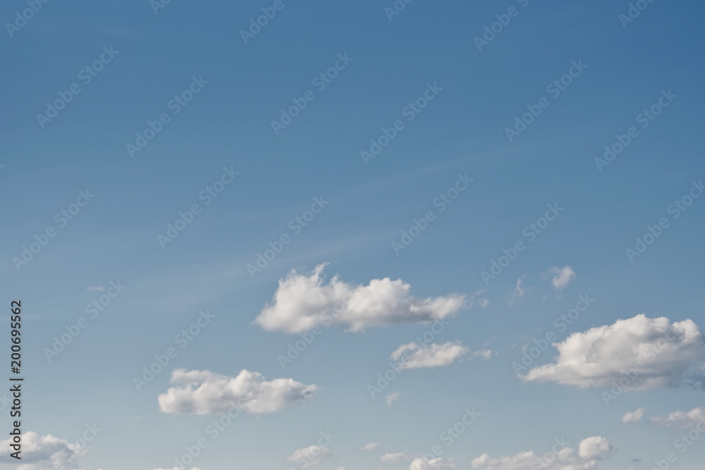 Clear blue sky with plain white cloud with space for text background. Clear blue sky with plain white cloud with space for text background.