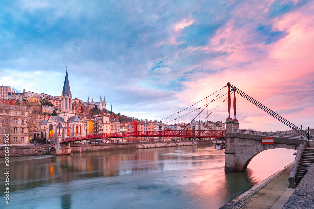 Obraz premium Saint Georges church and footbridge across Saone river, Old town with Fourviere cathedral at gorgeous sunset in Lyon, France