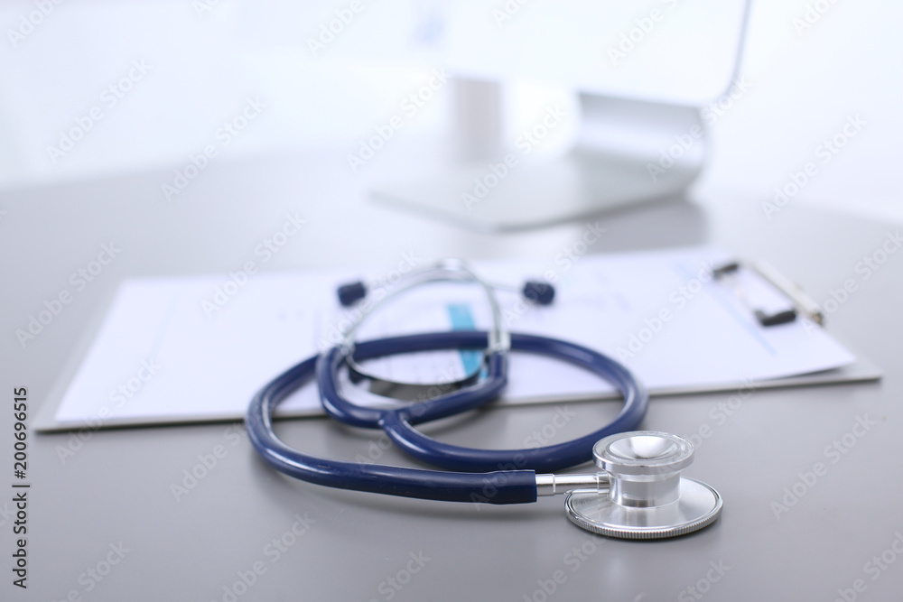 Medical equipment: blue stethoscope and tablet on white background. Medical equipment Medical equipment: blue stethoscope and tablet on white background. Medical equipment