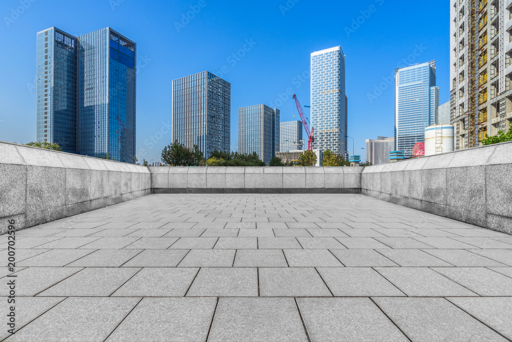 Panoramic skyline and buildings with empty square floor.