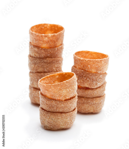 Stacks  of croustades crispy pastry cases isolated on white photo