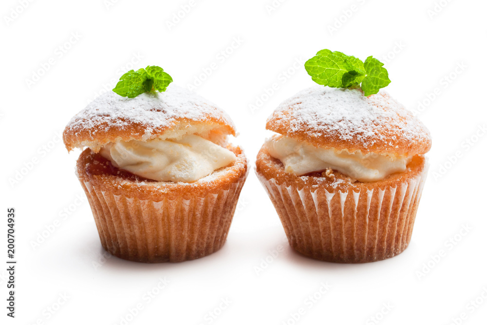 Cupcakes stuffed with white cream isolated on white Cupcakes stuffed with white cream isolated on white