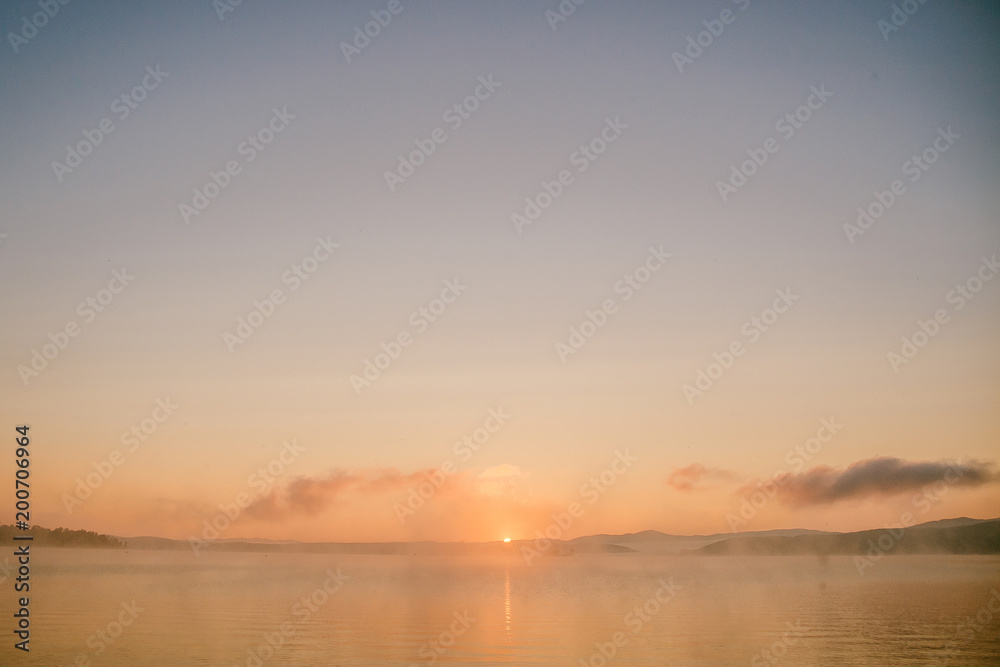 gentle soft light pink dawn on the big lake, Sunrise, calm, fog