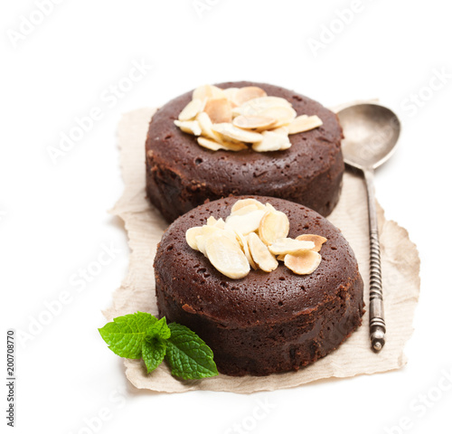 Chocolate fondant with almonds isolated on white
