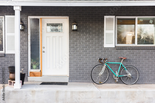 Fotografie, Obraz Turquoise bicycle or bike on front porch