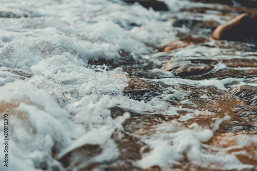 Beautiful rocky shore of the beach with waves crashing. Lazy beach, Koh Rong Sanloem. Vintage style filter  photo