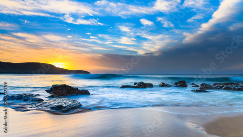 Blue Sunrise Seascape with Rocks and Clouds