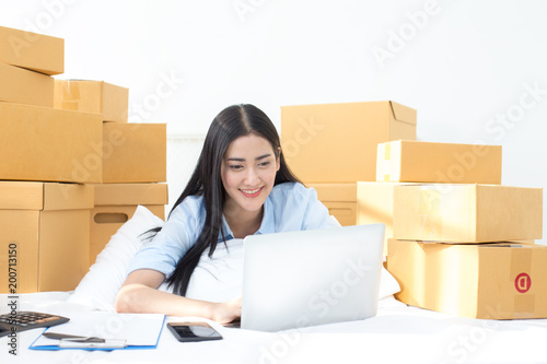 Young Asian Woman Working at home, Young Owner Woman Start up for Business Online. People with online shopping SME entrepreneur or freelance working concept.