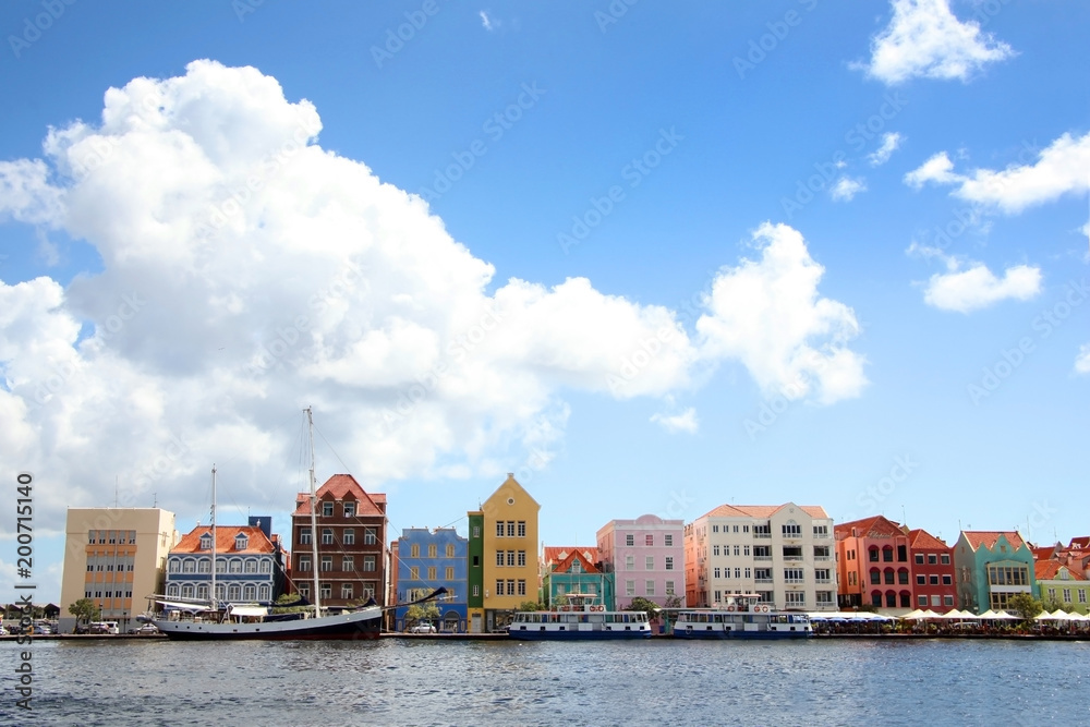 Waterfront of the Dutch Antilles town of Willemstad, with beautiful colorful buildings lining the waters edge, Curacao, Caribbean.