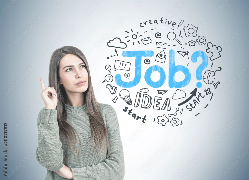 Thoughtful woman in green pointing up, job search Thoughtful woman in green pointing up, job search