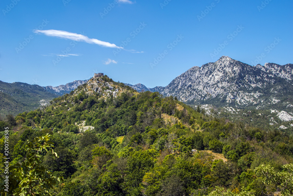 Obraz premium Europa, Montenegro, Orjen, mountain, sky, sun and fortress. Photo of a tourist postcard. Amazing place in the world. 