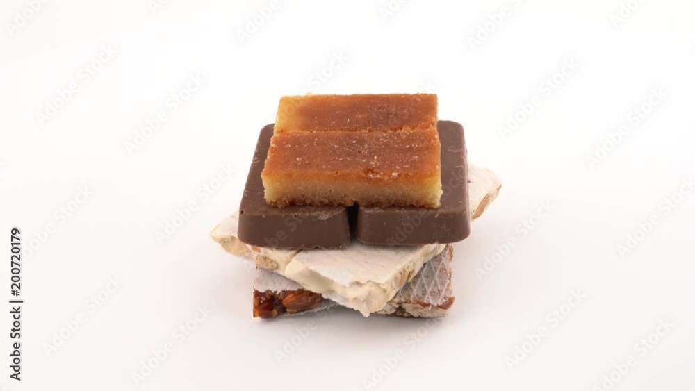 Soft and hard Turron traditional Christmas dessert in Spain and Italy and Latin America. Rotating on on white background. Isolated. Close up macro. Loopable. Soft and hard Turron traditional Christmas dessert in Spain and Italy and Latin America. Rotating on on white background. Isolated. Close up macro. Loopable.