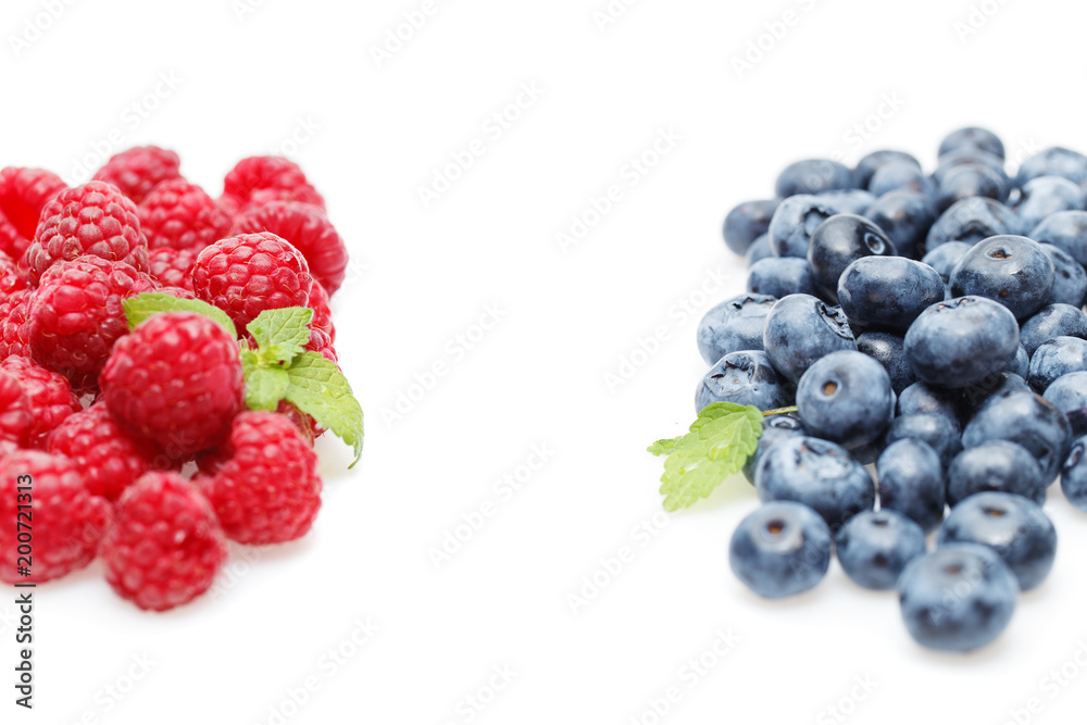 blueberry and raspberry berries isolated on white background blueberry and raspberry berries isolated on white background