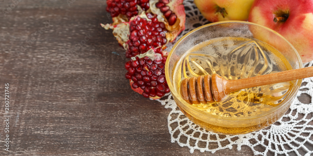 Rosh Hashanah concept, honey, apple, pomegranate Rosh Hashanah concept, honey, apple, pomegranate
