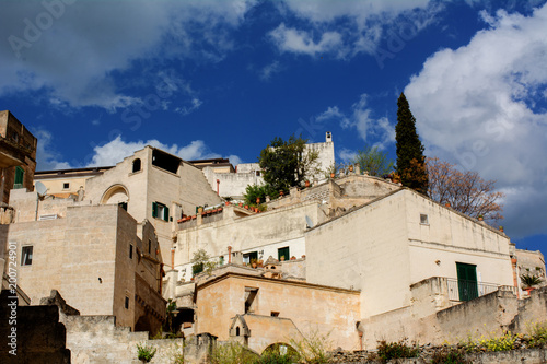 Horizontal View of some Historical Buindings on Blue Sky Background. Matera, South of Italy photo