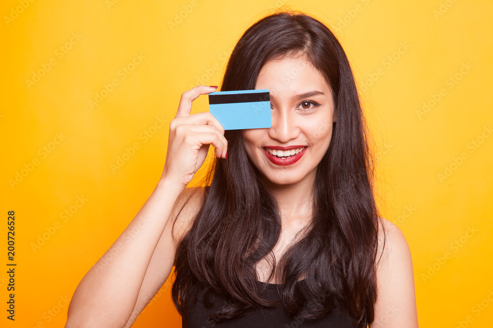 Young Asian woman happy with blank card. Young Asian woman happy with blank card.