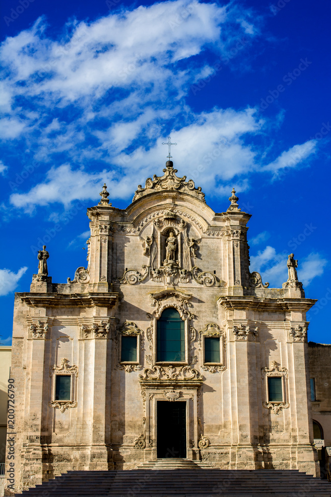 Vertical View of the Church of San Francesco D'assisi on Blue Sky Background. Matera, South of Italy