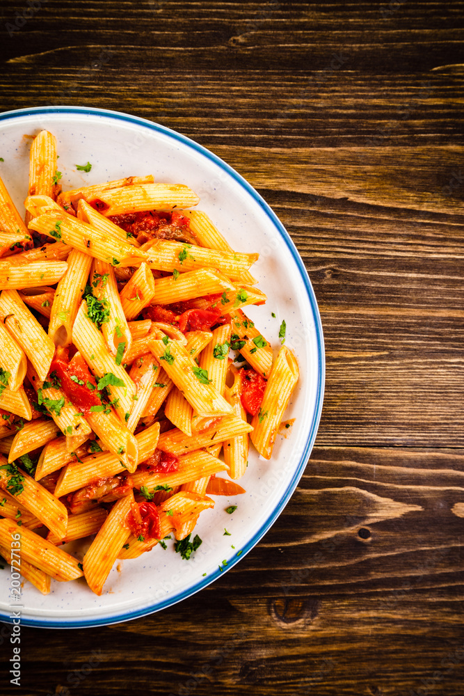 Penne with meat, tomato sauce and vegetables Penne with meat, tomato sauce and vegetables
