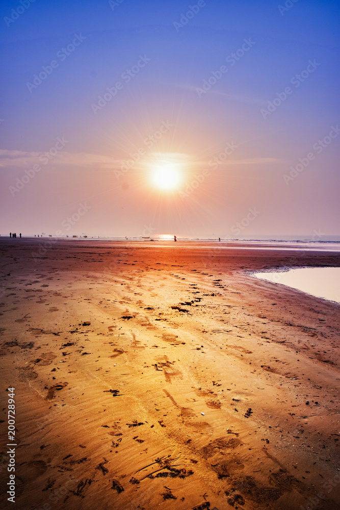 The Beach  with Silhouette in the Sunrise  at the sea beach of east cost India.