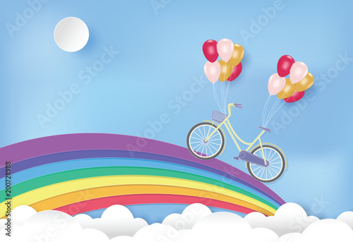 Paper art of rainbow with bicycle and balloons on blue sky paper cut style illustration