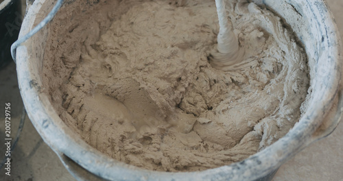 mixing concrete plaster with electric mixer