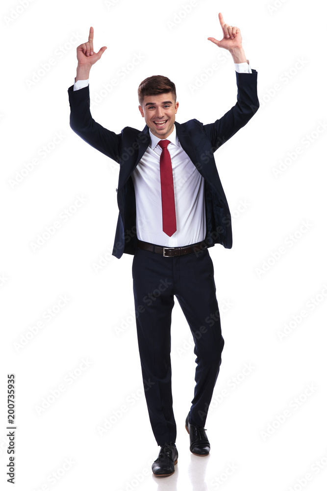 excited walking businessman celebrates success excited walking businessman celebrates success