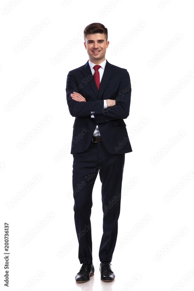 happy businessman standing with arms folded happy businessman standing with arms folded