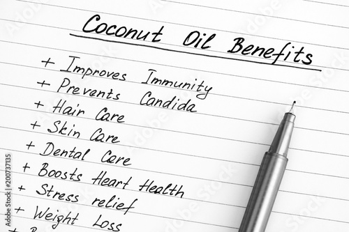 List of Coconut Oil Benefits with pen.