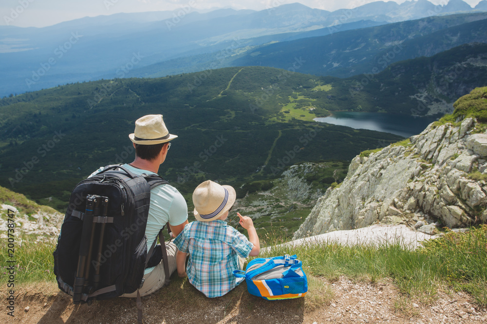 Fototapeta premium Father and son traveling in Rila mountains Bulgaria