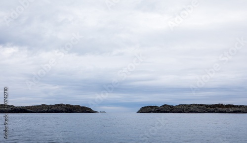 The Rovaer archipelago in Haugesund, in the norwegian west coast. Ocean, islands and sky with clouds.