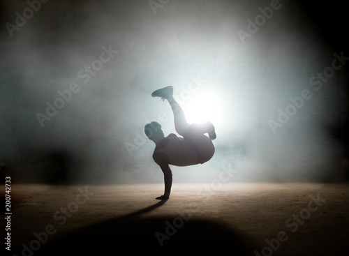 process of doing freeze without difficulties.demonstate skills. mixture of coordination. dancing element photo