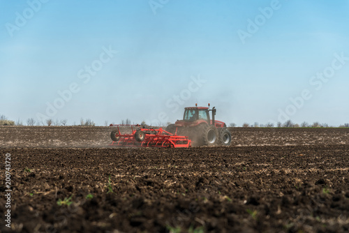 Tractor plowing fields.