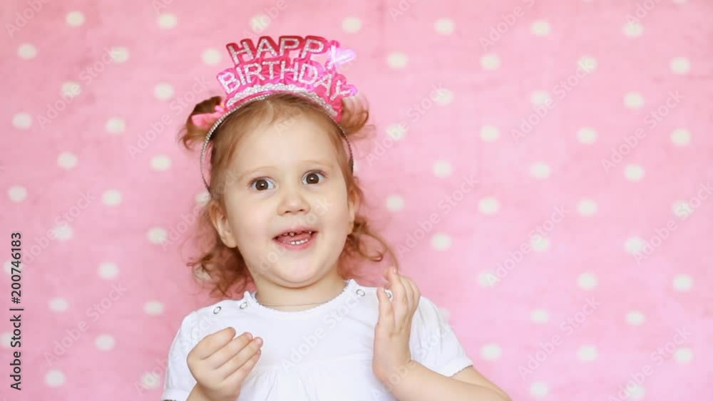 Little sweet girl sings a song with a birthday. Congratulations on the holiday from a funny child. Little sweet girl sings a song with a birthday. Congratulations on the holiday from a funny child.