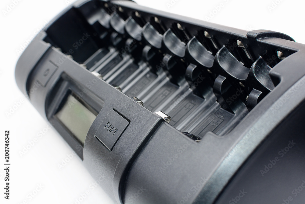 Quick and soft eigth cell AA, AAA, C, D black ultimate professional battery charger on white background.