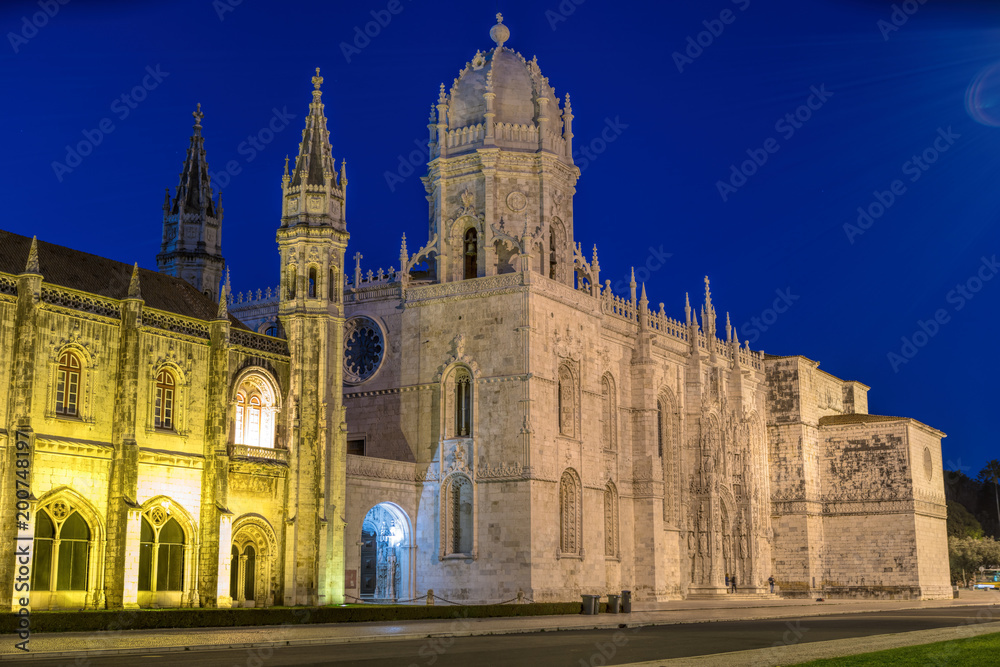 Facade of the Jeronimos (Hieronymites) Monastery in the Belem district of Lisbon illuminated at night