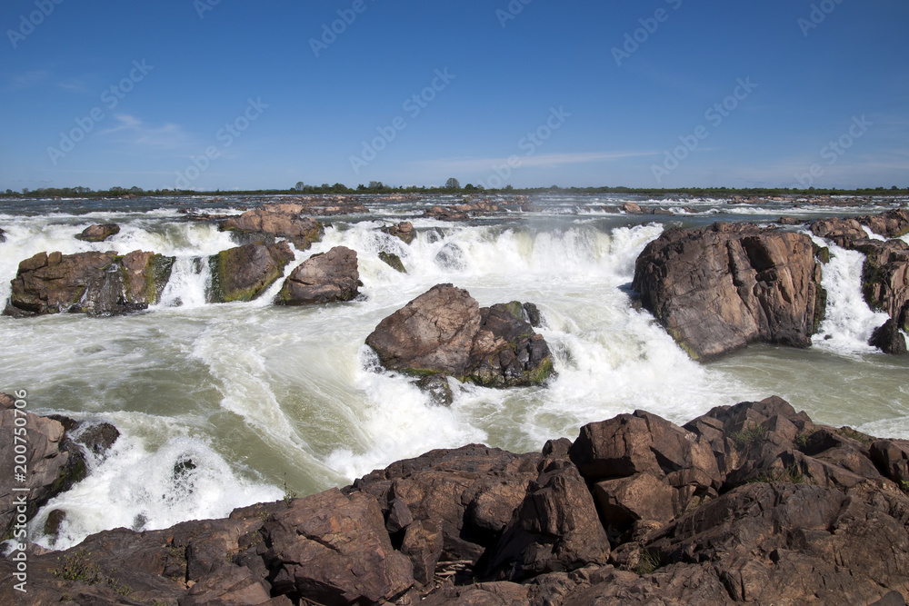 Preah Rumkel Cambodia, Preah Nimith waterfall and rapids on the Mekong river along the Cambodian Lao border in dry season Preah Rumkel Cambodia, Preah Nimith waterfall and rapids on the Mekong river along the Cambodian Lao border in dry season