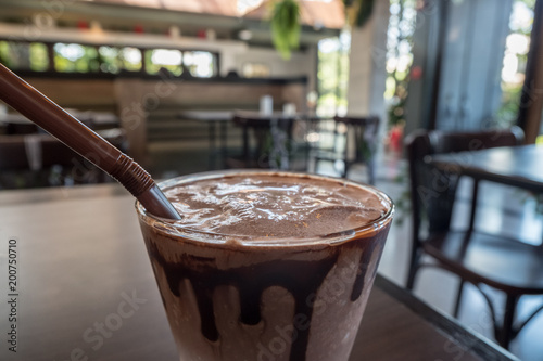 Close up of coco frappe with blurred restaurant background