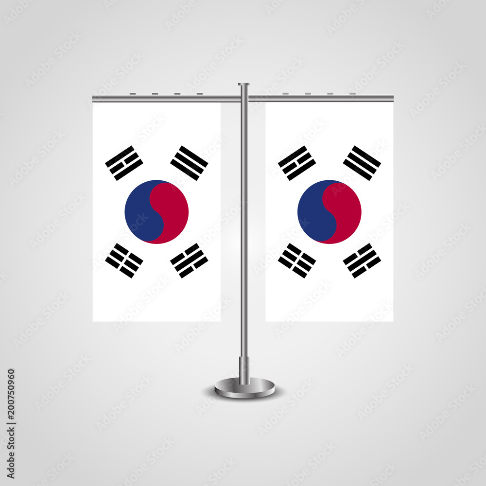 Table stand with flags of South Korea and South Korea.Two flag. Flag pole. Symbolizing the cooperation between the two countries. Table flags Table stand with flags of South Korea and South Korea.Two flag. Flag pole. Symbolizing the cooperation between the two countries. Table flags