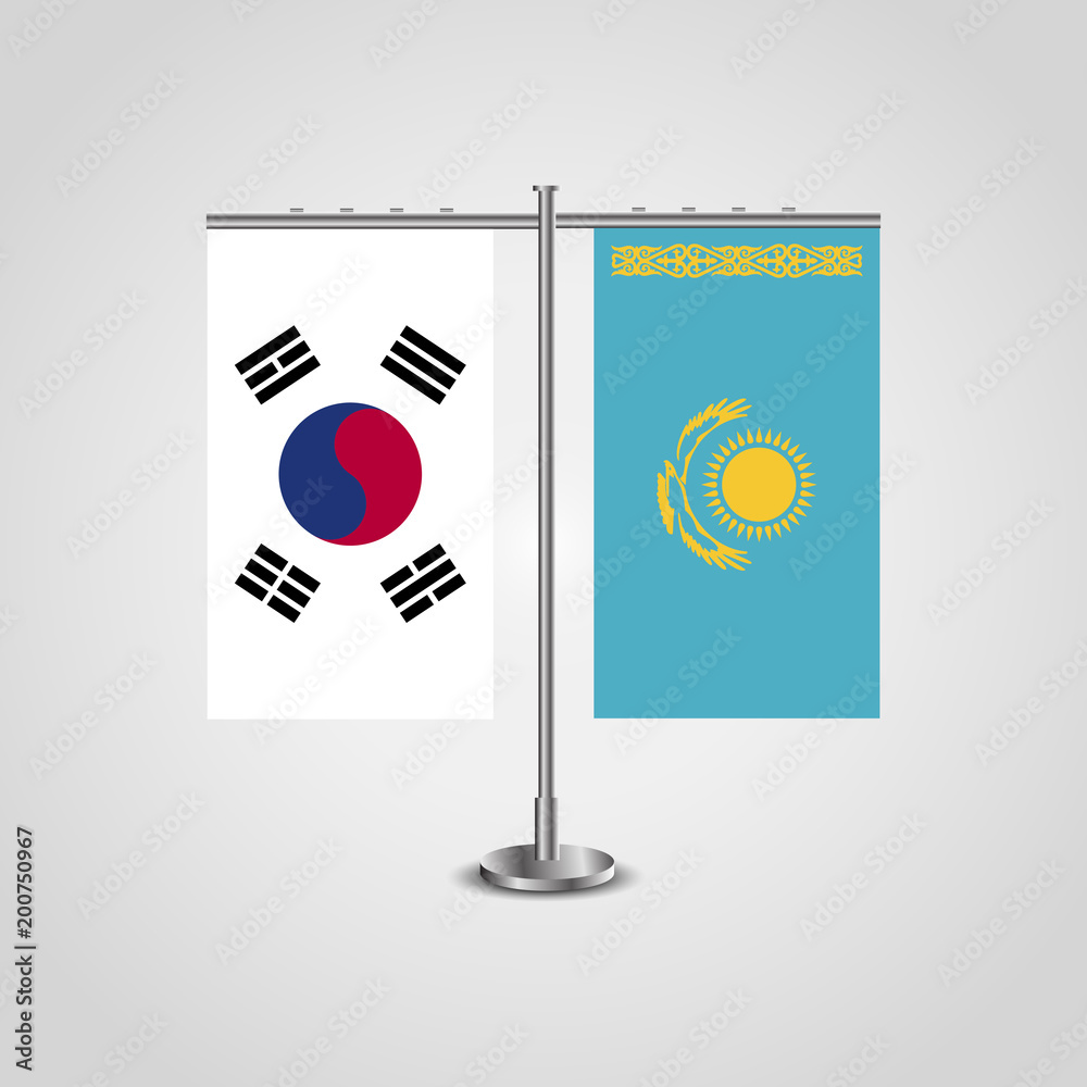 Table stand with flags of South Korea and Kazakhstan.Two flag. Flag pole. Symbolizing the cooperation between the two countries. Table flags Table stand with flags of South Korea and Kazakhstan.Two flag. Flag pole. Symbolizing the cooperation between the two countries. Table flags