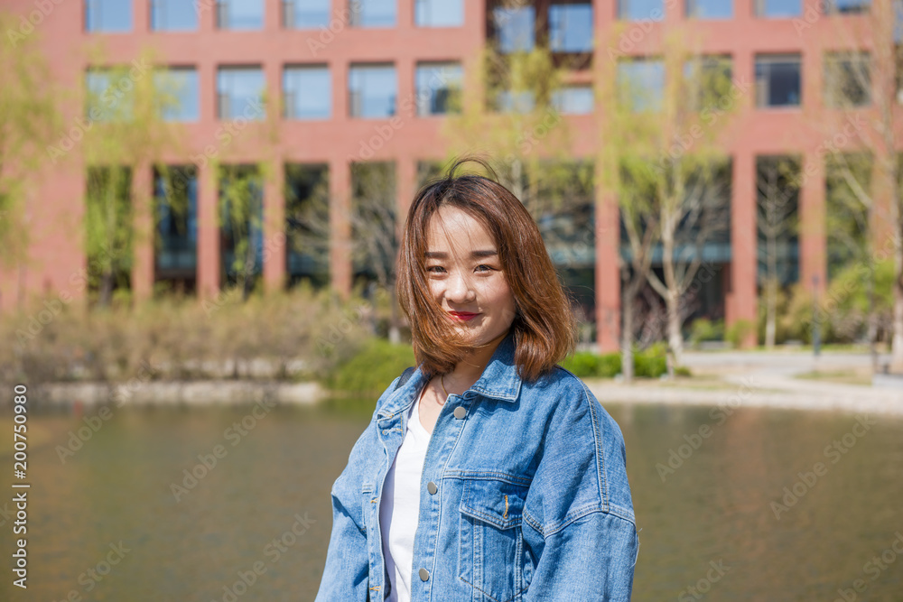 Girl student in university. Portrait of young Asian female university student - Asian Chinese woman. Girl student in university. Portrait of young Asian female university student - Asian Chinese woman.