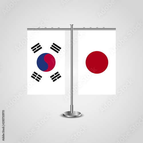 Table stand with flags of South Korea and Japan.Two flag. Flag pole. Symbolizing the cooperation between the two countries. Table flags