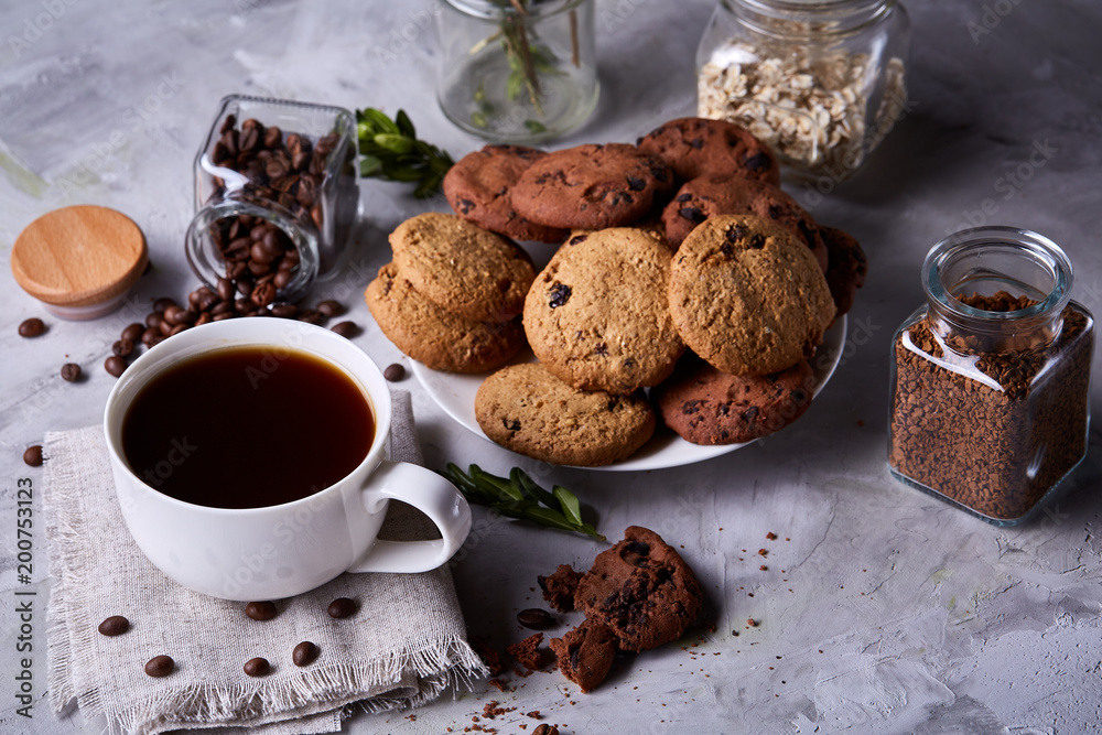 Breakfast background with mug of fresh coffee, homemade oatmeal cookies, grind coffee Breakfast background with mug of fresh coffee, homemade oatmeal cookies, grind coffee
