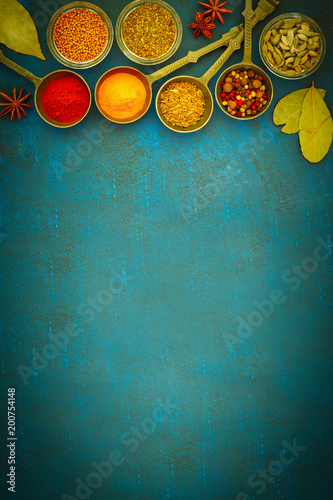 Fototapeta Naklejka Na Ścianę i Meble -  Wooden table of colorful spices