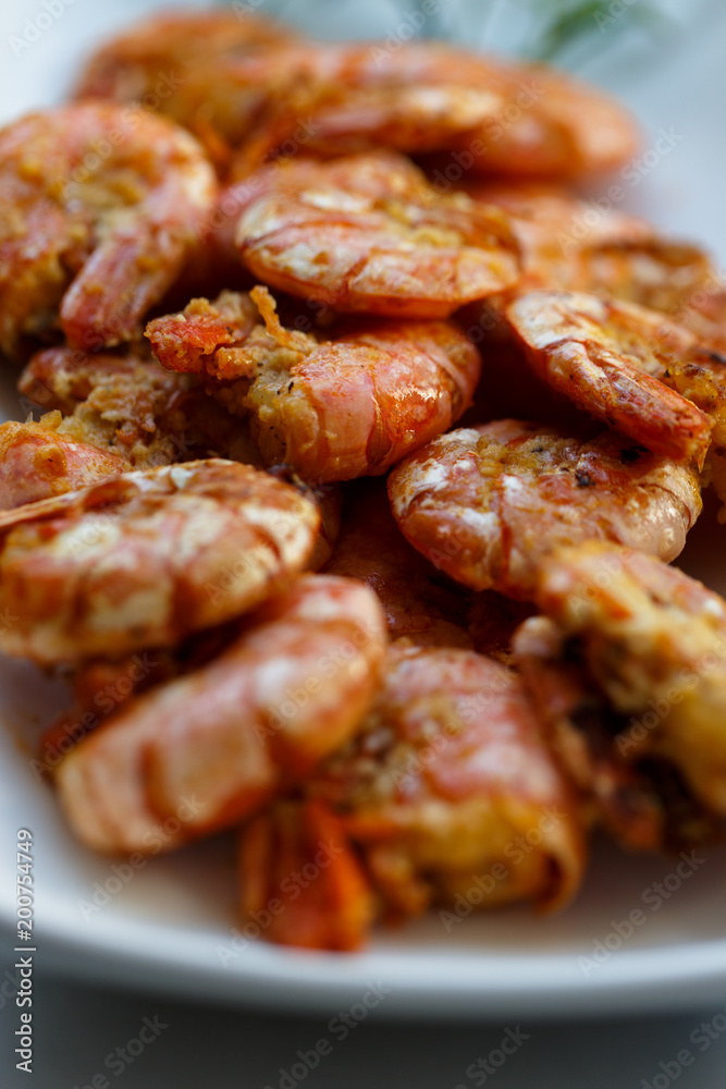 row tiger shrimp with lemon on white row tiger shrimp with lemon on white