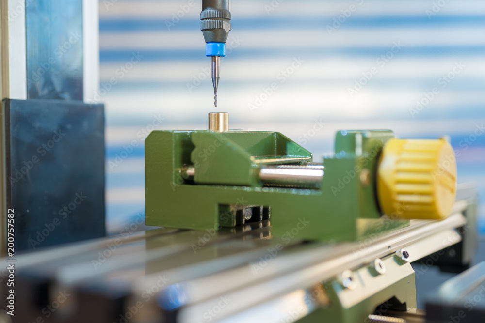 CNC milling machine processing plastic detail.Cutting plastic modern processing CNC milling machine processing plastic detail.Cutting plastic modern processing