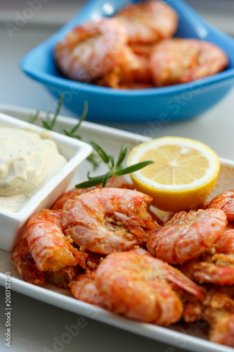 row tiger shrimp with lemon on white